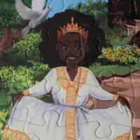 Das Puzzle entstand durch eine äthiopische Kinderbuchautorin, so gibt es ein äthiopisches Mädchen in traditionellem Kleid.